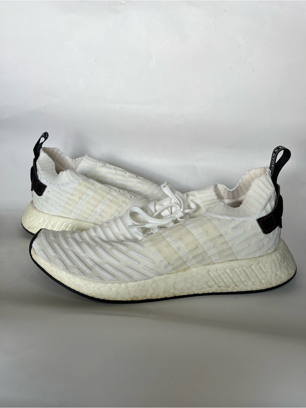 Adidas Men's NMD_R2 Primeknit US 11 sneakers in a white & black colorway
